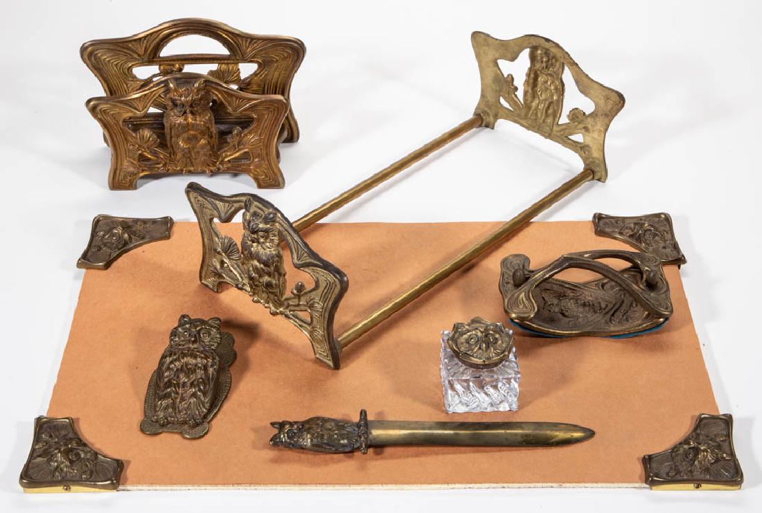 H. L. JUDD CO. ATTRIBUTED ART NOUVEAU FIGURAL OWL: H. L. JUDD CO. ATTRIBUTED ART NOUVEAU FIGURAL OWL CAST-METAL DESK SET, LOT OF SEVEN, comprising a stationary holder, paper clip, book rack, paper knife, ink blotter, glass inkwell with cover, and blot