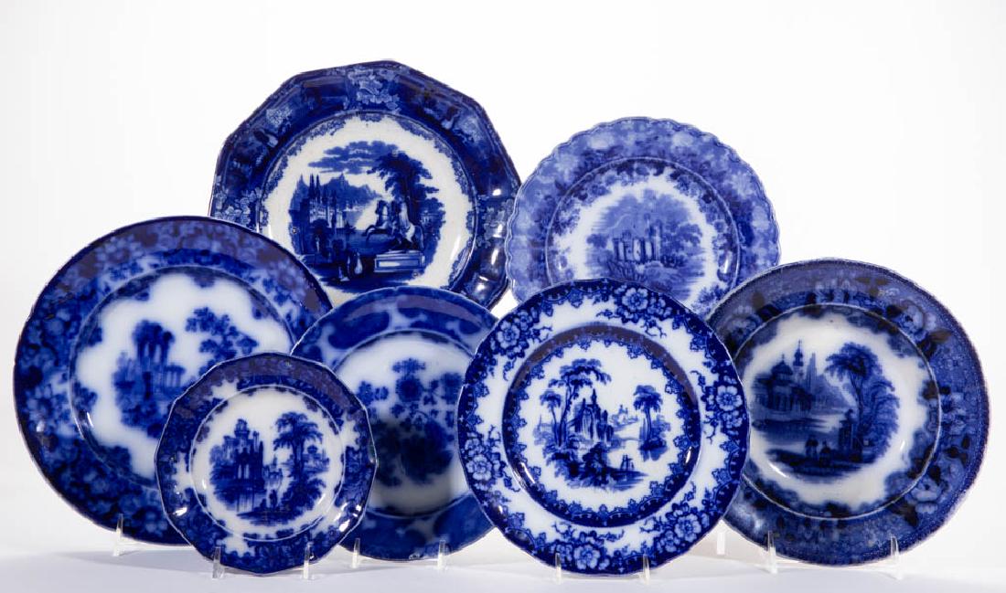 ENGLISH TRANSFER-PRINTED FLOW BLUE IRONSTONE CERAMIC: ENGLISH TRANSFER-PRINTED FLOW BLUE IRONSTONE CERAMIC ARTICLES, LOT OF 12, comprising one 9 1/2" D soup plate having "Bosphorus" pattern, two serving bowls, one having "Country Scenes" pattern, one 15"