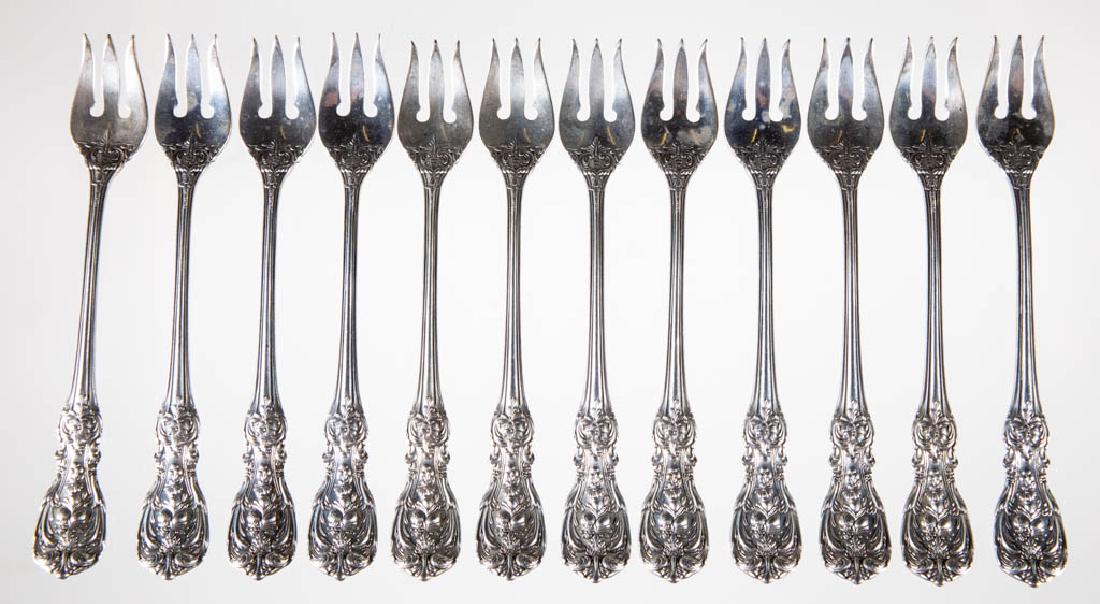 REED & BARTON "FRANCIS I" STERLING SILVER OYSTER FORKS,: REED & BARTON "FRANCIS I" STERLING SILVER OYSTER FORKS, SET OF 12, multi-motif pattern designed by Ernest Meyers, each having an ornate handle with relief foliate and fruit designs. Each with "STERLIN