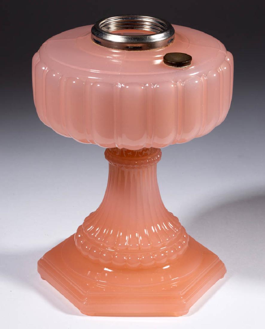 ALADDIN MODEL B-111 / CATHEDRAL KEROSENE STAND LAMP: ALADDIN MODEL B-111 / CATHEDRAL KEROSENE STAND LAMP, Rose Moonstone, radial groove collar, replacement screw-cap. The Mantle Lamp Company Of America (Aladdin). 1934. 9 1/2" H, 6 1/2" D base.Undamaged.