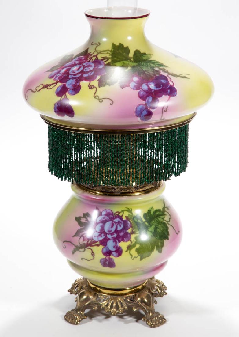 VICTORIAN ENAMEL-DECORATED PARLOR / GONE WITH THE WIND: VICTORIAN ENAMEL-DECORATED PARLOR / GONE WITH THE WIND LAMP, opaque white with rose and yellow-green ground, polychrome Vintage stencil decoration, matching decorated umbrella-form shade, globular-for