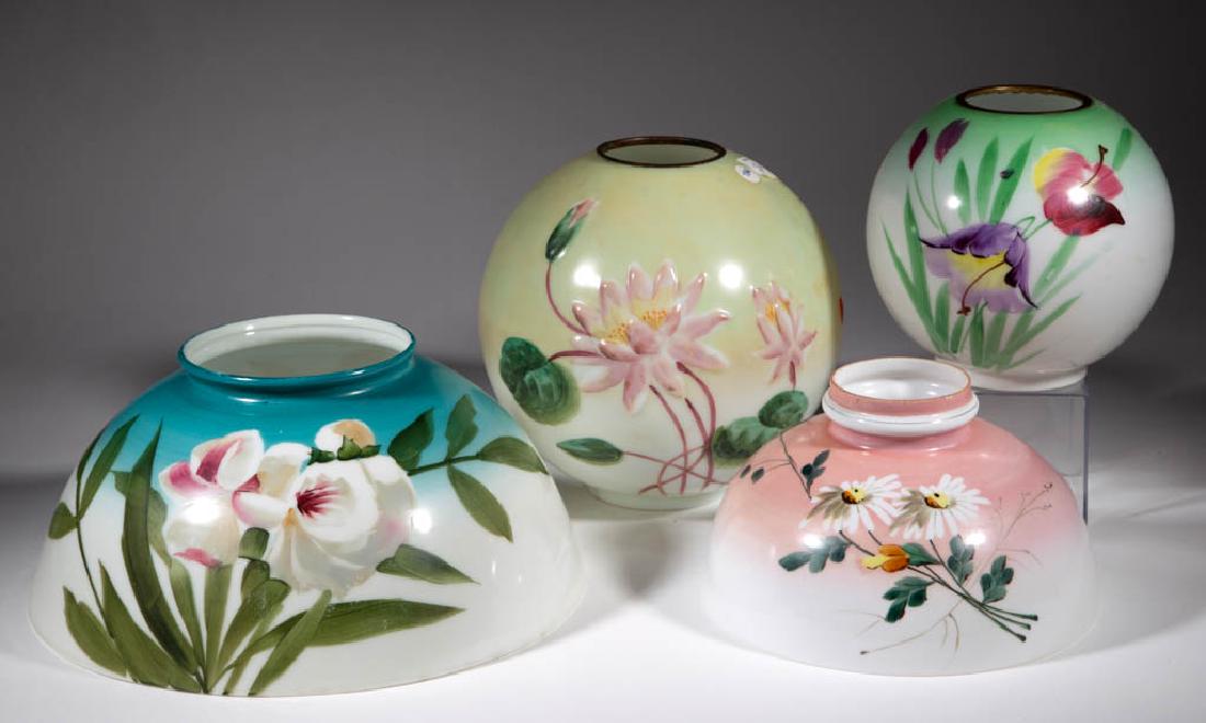 ASSORTED ENAMEL-DECORATED OPAL LAMP SHADES, LOT OF FOUR: ASSORTED ENAMEL-DECORATED OPAL LAMP SHADES, LOT OF FOUR, various stains and polychrome floral decoration, comprising two-ball form examples with brass heat rings, including one with molded flowers and