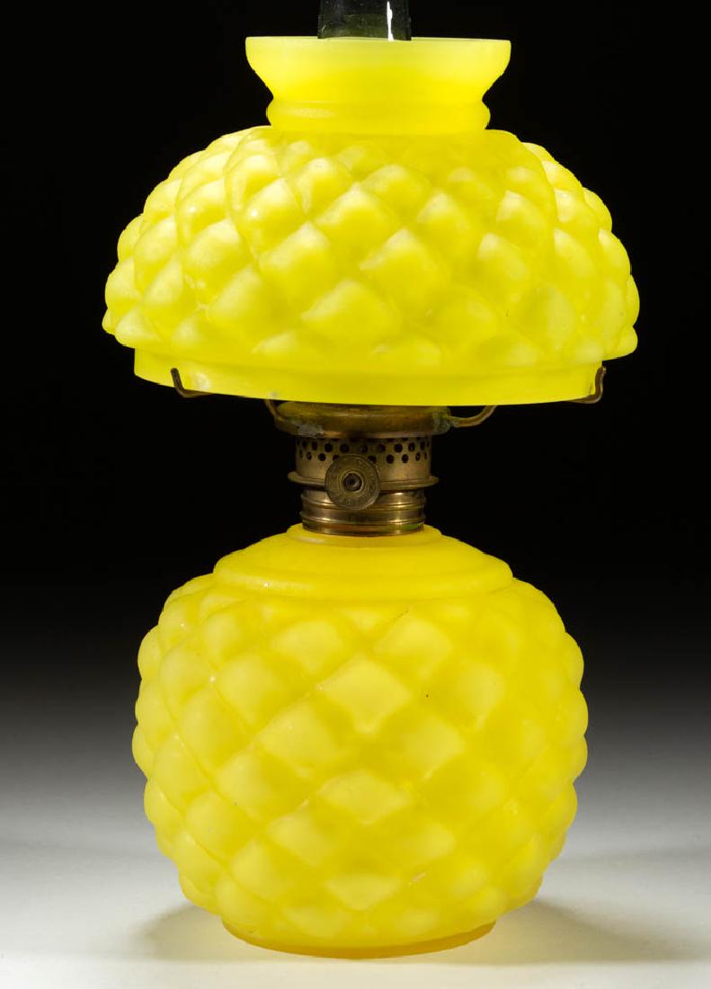 CONE MINIATURE LAMP: CONE MINIATURE LAMP, cased lemon yellow with satin finish, ball-form font, matching pattern umbrella shade, period collar. Fitted with a Plume & Atwood Nutmeg burner, colorless chimney. Consolidated L