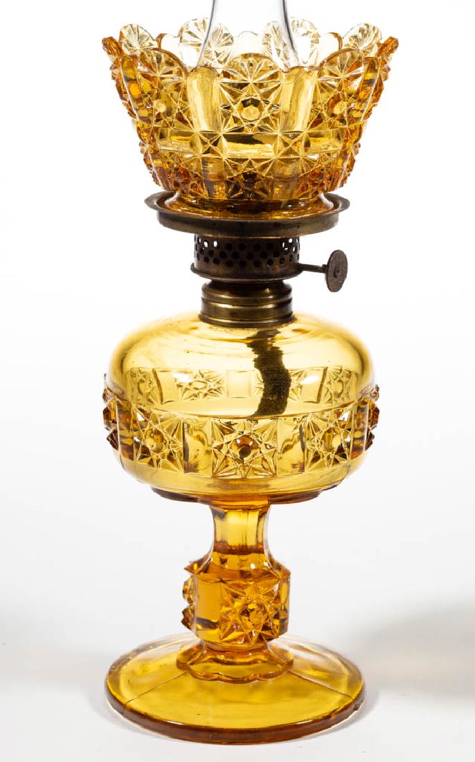 DAISY AND CUBE / STARS AND BARS MINIATURE STAND LAMP: DAISY AND CUBE / STARS AND BARS MINIATURE STAND LAMP, honey amber, compressed globular font on patterned standard, matching pattern crown-form shade, period collar. Fitted with a Plume & Atwood Nutmeg