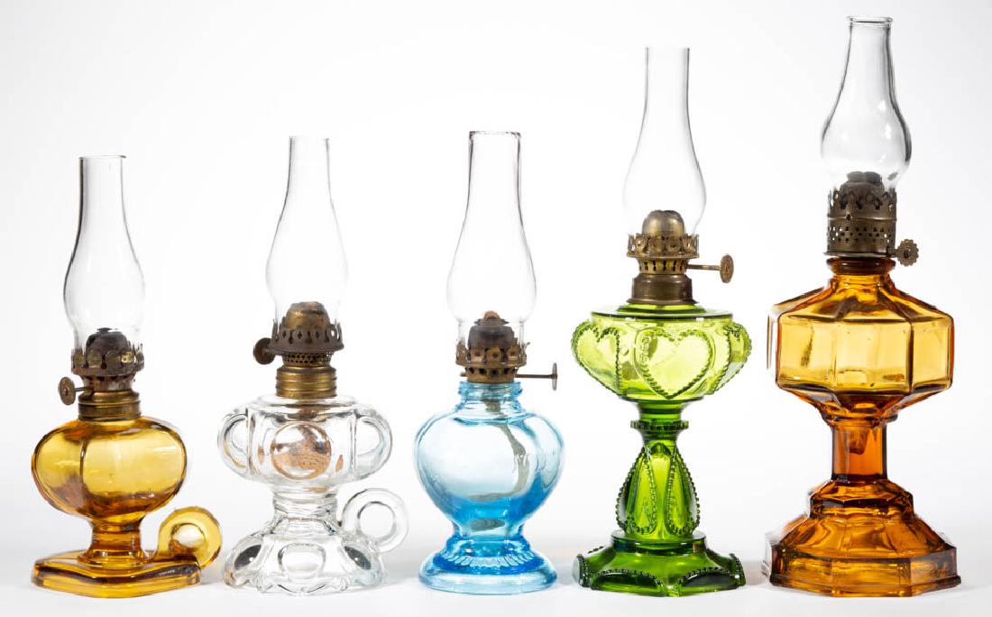 ASSORTED PATTERN MINIATURE LAMP BASES, LOT OF FIVE: ASSORTED PATTERN MINIATURE LAMP BASES, LOT OF FIVE, amber, blue, colorless and green, comprising three stand examples, including a Handy/Smith I, fig. 5, an Octavia/Smith I, fig. 106, and a Beaded Hea