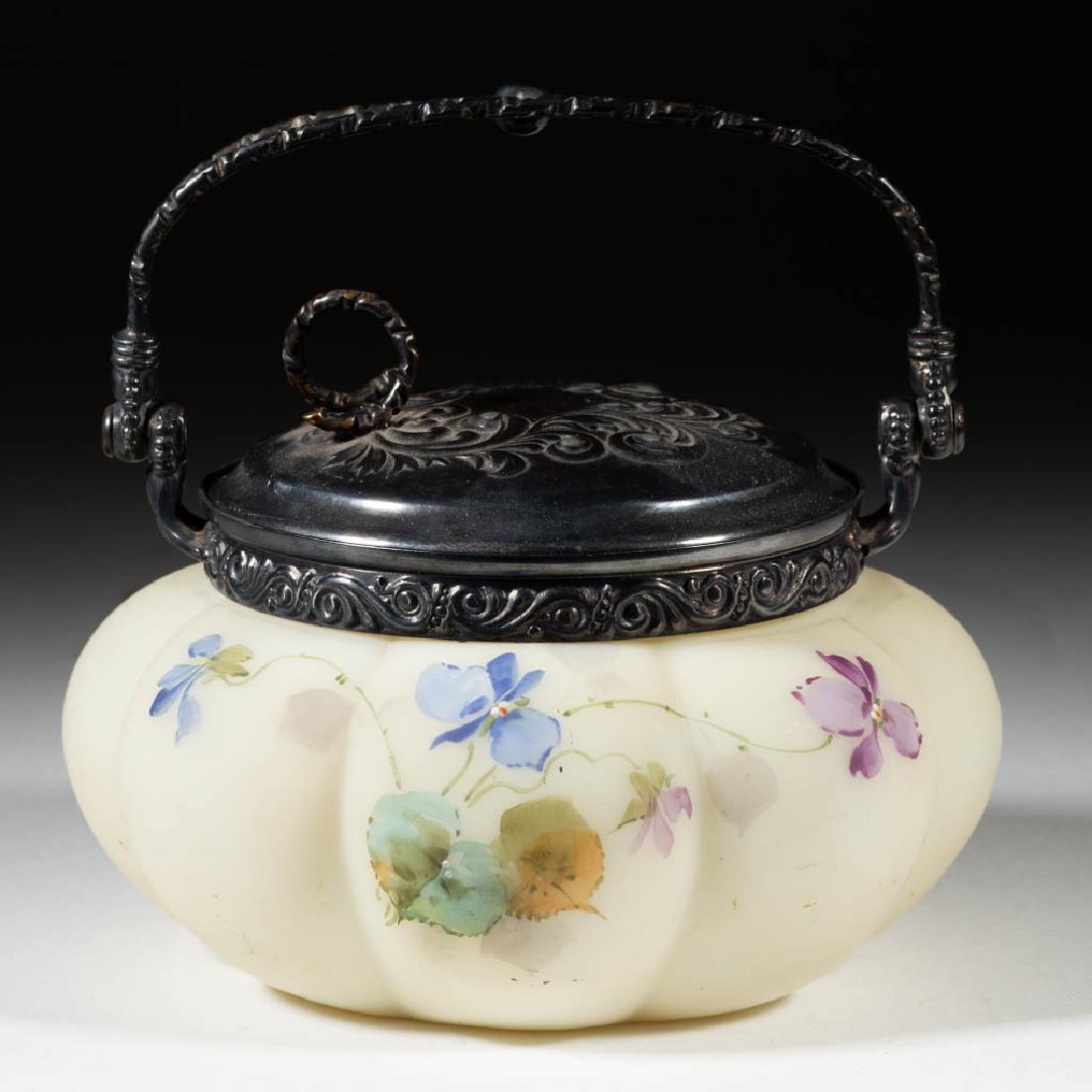 SMITH BROS. MELON LOBED GLASS CRACKER JAR: SMITH BROS. MELON LOBED GLASS CRACKER JAR, opaque white with polychrome-enamel decoration, eight-lobe body with floral decoration, original quadruple-plate mouth, cover, and handle, signed with lion i