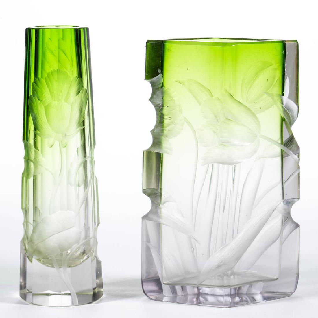 MOSER INTAGLIO CUT ART GLASS VASES, LOT OF TWO: MOSER INTAGLIO CUT ART GLASS VASES, LOT OF TWO, green shaded to colorless, comprising a tapered eight-panel and a diamond form example, each with floral decoration, factory-polished rims and bases. Bo