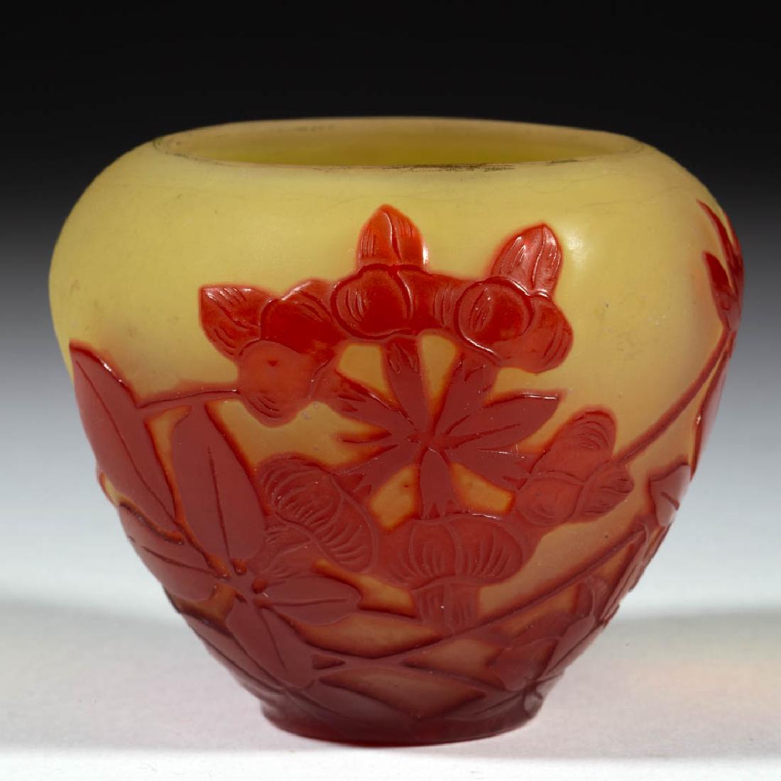 GALLE CAMEO ART GLASS CABINET VASE: GALLE CAMEO ART GLASS CABINET VASE, ruby to yellow, ovoid form with floral decoration, signed "GALLE", polished pontil mark. France. First quarter 19th century. 2 1/2" H.Undamaged.Provenance: Estate o