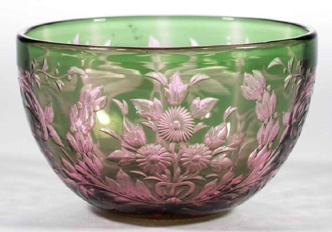 ROCK CRYSTAL OVERLAY CUT GLASS BOWL: ROCK CRYSTAL OVERLAY CUT GLASS BOWL, green to cranberry, ornate floral and laurel decoration, rayed base, unsigned. Probably Stevens and Williams. Late 19th/early 20th century. 2 1/2" H, 4" D rim. Und