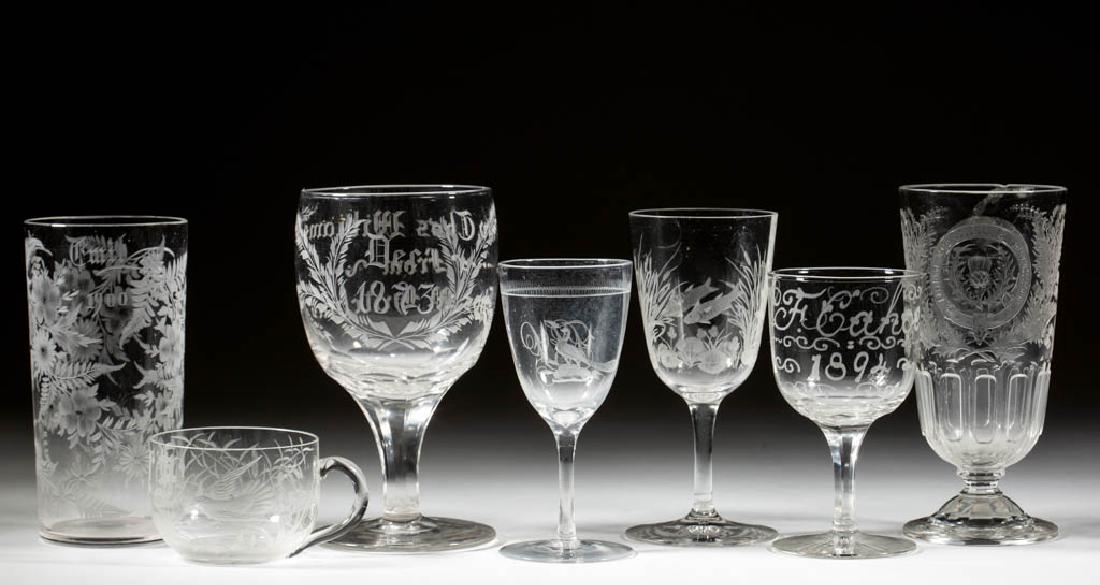 ASSORTED FREE-BLOWN AND ENGRAVED GLASS DRINKING: ASSORTED FREE-BLOWN AND ENGRAVED GLASS DRINKING ARTICLES, LOT OF SEVEN, colorless, comprising three wines, a tumbler, a footed tumbler, a goblet, and a punch cup, each with ornate engraved decoration.