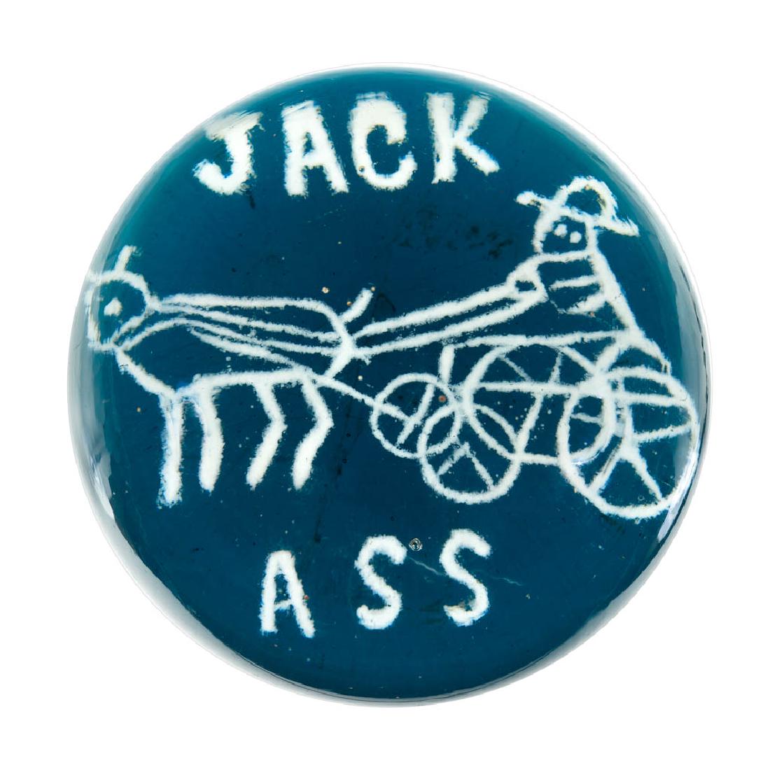 "JACK ASS" FRIT DECORATED GLASS MAGNUM PAPERWEIGHT: "JACK ASS" FRIT DECORATED GLASS MAGNUM PAPERWEIGHT, colorless, depicting a donkey pulling a cart, all above a teal ground, polished base. United States. First half 20th century. 3 5/8" D. Virtually un