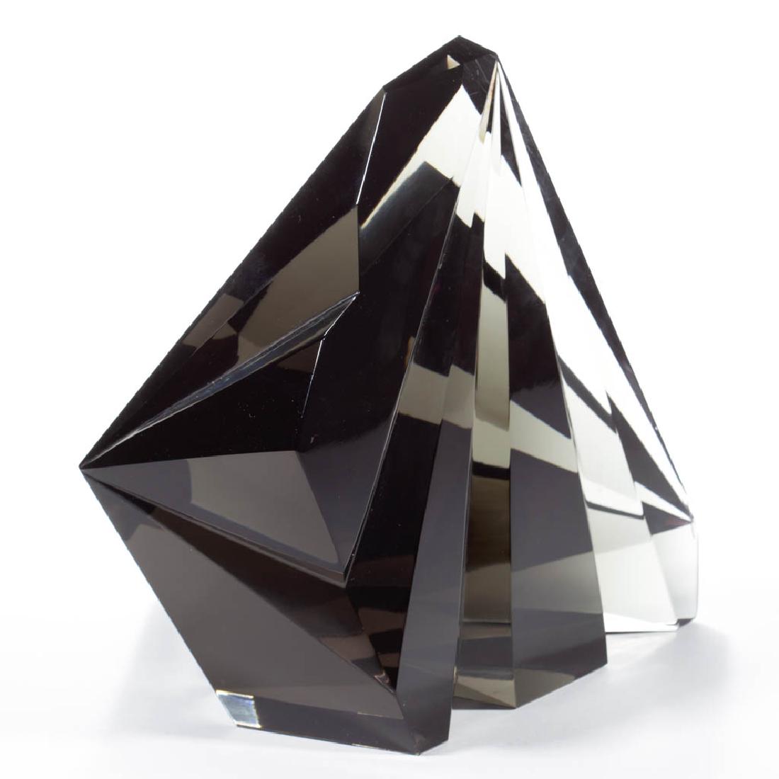 VICKE LINDSTRAND ABSTRACT STUDIO ART GLASS SCULPTURE: VICKE LINDSTRAND ABSTRACT STUDIO ART GLASS SCULPTURE, deep smoky quartz, V-form cuts merging at two opposite points, signed "KOSTA V. LINDSTRAND UNICA". Sweden. 20th century. 9" HOA, 10" DOA. Vey good