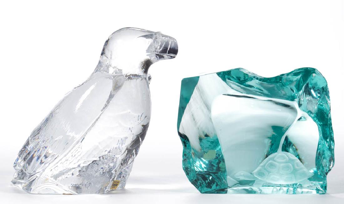 ASSORTED SWEDISH STUDIO ART GLASS ARTICLES, LOT OF TWO: ASSORTED SWEDISH STUDIO ART GLASS ARTICLES, LOT OF TWO, comprising an aquamarine chipped quartz sculpture with an engraved turtle to the face, signed, and a pressed Kosta Boda eagle, signed to the und