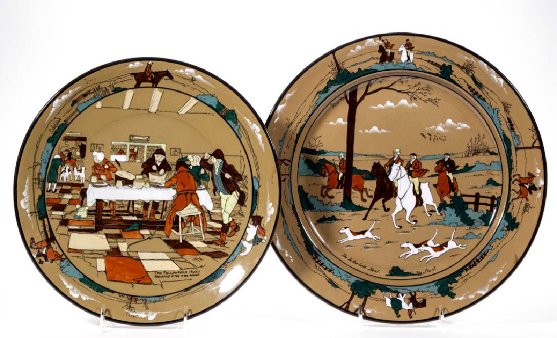 AMERICAN BUFFALO POTTERY DELDARE "THE FALLOWFIELD HUNT": AMERICAN BUFFALO POTTERY DELDARE "THE FALLOWFIELD HUNT" CERAMIC PLAQUES, LOT OF TWO, having scenes "The Start." and "Breakfast at the Three Pigeons", each on olive ground, with signatures "P. Hall" an