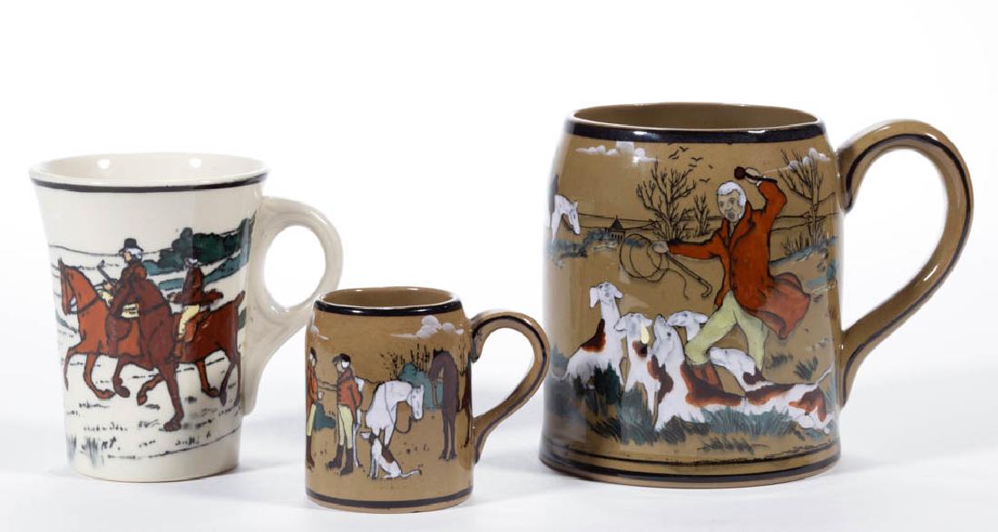 AMERICAN BUFFALO POTTERY "THE FALLOWFIELD HUNT" CERAMIC: AMERICAN BUFFALO POTTERY "THE FALLOWFIELD HUNT" CERAMIC DRINKING ARTICLES, LOT OF THREE, comprising two mugs having hunt scenes on olive ground with signatures "O. S." and "B. Wilton", and black print