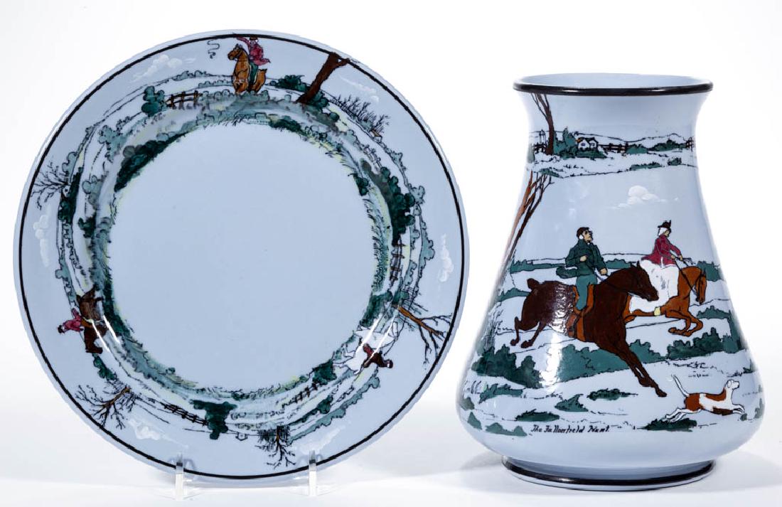 AMERICAN BUFFALO POTTERY "THE FALLOWFIELD HUNT" BLUE: AMERICAN BUFFALO POTTERY "THE FALLOWFIELD HUNT" BLUE LUNE WARE CERAMIC ARTICLES, LOT OF TWO, comprising a vase with scene "Breaking Cover." depicting people on horseback with hounds and a 9" D plate w