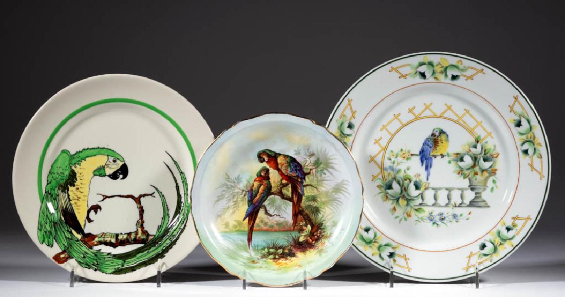 AMERICAN BUFFALO POTTERY PARROT CERAMIC PLATES, LOT OF: AMERICAN BUFFALO POTTERY PARROT CERAMIC PLATES, LOT OF THREE, comprising one having a brightly colored green and yellow macaw with curved tail and two having designs depicting vibrant polychrome perch