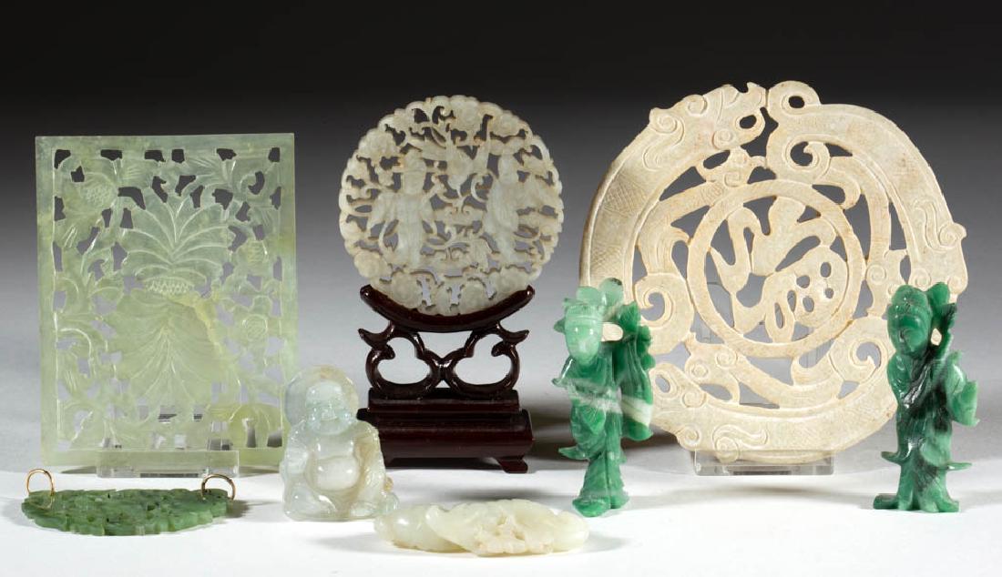 CHINESE CARVED JADE / HARDSTONE PLAQUES AND FIGURES,: CHINESE CARVED JADE / HARDSTONE PLAQUES AND FIGURES, LOT OF EIGHT, comprising a large circular plaque, four nephrite examples including a circular plaque with wooden stand, and three jadeite figures. 