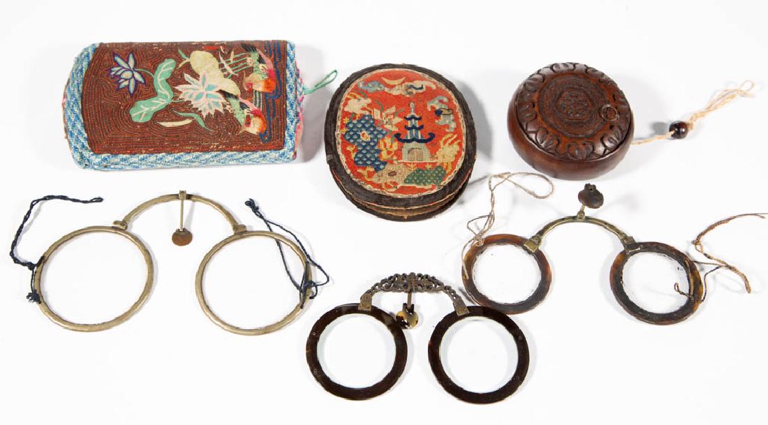 CHINESE EYEGLASSES AND CASES, LOT OF THREE: CHINESE EYEGLASSES AND CASES, LOT OF THREE, including a two-part case decorated with birds, and a carved wooden example with horn-rimmed folding glasses. Second half 19th/early 20th century. 2 1/2" to