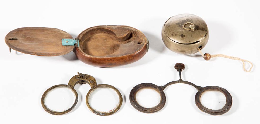 CHINESE EYEGLASSES AND CASES, LOT OF TWO: CHINESE EYEGLASSES AND CASES, LOT OF TWO, comprising a wooden case with hinged lid and folding glasses, and metal case with dark horn-rimmed glasses. Second half 19th/early 20th century. 2 1/2" and 4"