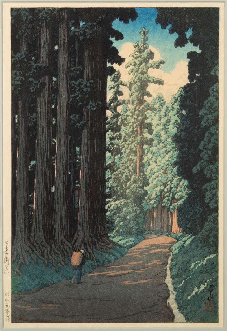 KAWASE HASUI (JAPANESE, 1883-1957) WOODBLOCK PRINT: KAWASE HASUI (JAPANESE, 1883-1957) WOODBLOCK PRINT, "The Road to Nikko", depicting a figure walking down a dirt road flanked by tall trees, Hasai signature and red Kawase seal in lower right corner, p