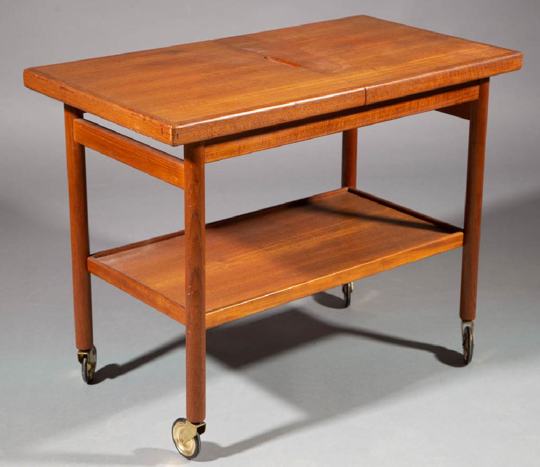 KURT OSTERVIG FOR MOBLER MID-CENTURY MODERN TEAK MODEL: KURT OSTERVIG FOR MOBLER MID-CENTURY MODERN TEAK MODEL 111 TEA / BAR CART, top folds out concealing a black laminate serving center, underside stamped "FURNITURE MAKERS / DANISH", with original caster