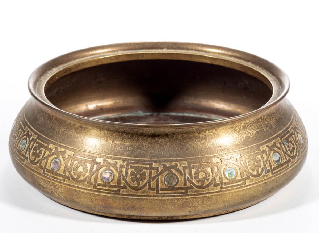 TIFFANY STUDIOS NO. 1729 / ABALONE BRONZE PLANTER: TIFFANY STUDIOS NO. 1729 / ABALONE BRONZE PLANTER, mother-of-pearl decoration, low bowl with floral key medial band, signed. Tiffany Studios. First quarter 20th century. 2 3/4" H, 9" DOA.Good conditio
