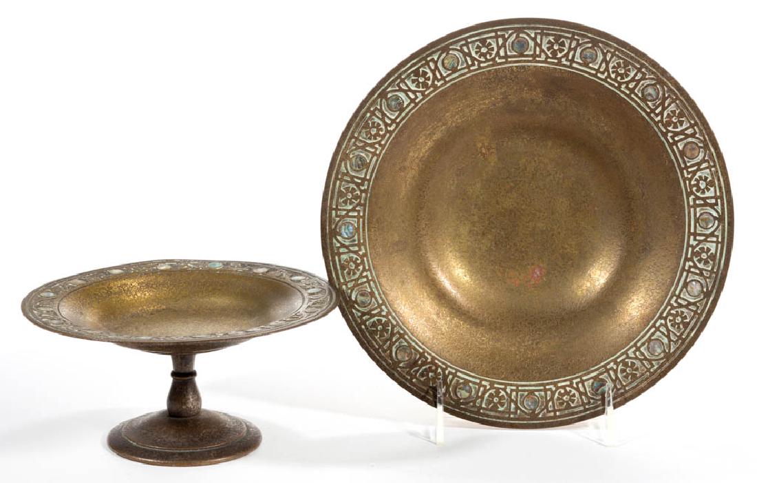 TIFFANY STUDIOS ABALONE BRONZE TABLE ARTICLES, LOT OF: TIFFANY STUDIOS ABALONE BRONZE TABLE ARTICLES, LOT OF TWO, mother-of-pearl decoration, comprising a No. 1703 footed compote and a No. 1723 card tray. Tiffany Studios. First quarter 20th century. Compo