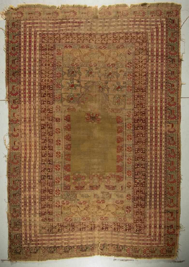 ANTIQUE TURKISH PRAYER RUG: ANTIQUE TURKISH PRAYER RUG, with cream field. Third quarter 19th century. 5' 1" x 7' 7".Heavy signs of usage wear, minor to moderate losses to the edges and trim, moderate to heavy loss of color, with