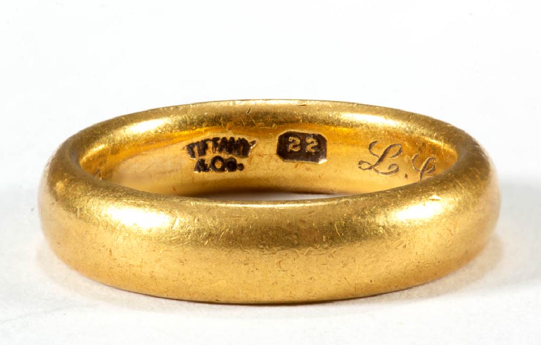 ANTIQUE TIFFANY & CO. 22K YELLOW GOLD BAND: ANTIQUE TIFFANY & CO. 22K YELLOW GOLD BAND, having a plain design with personalized engraving of "L.C.B - L.C.H. Jan. 21, 1903" to interior. "TIFFANY / &Co. / 22" mark to interior band. Total weight: 