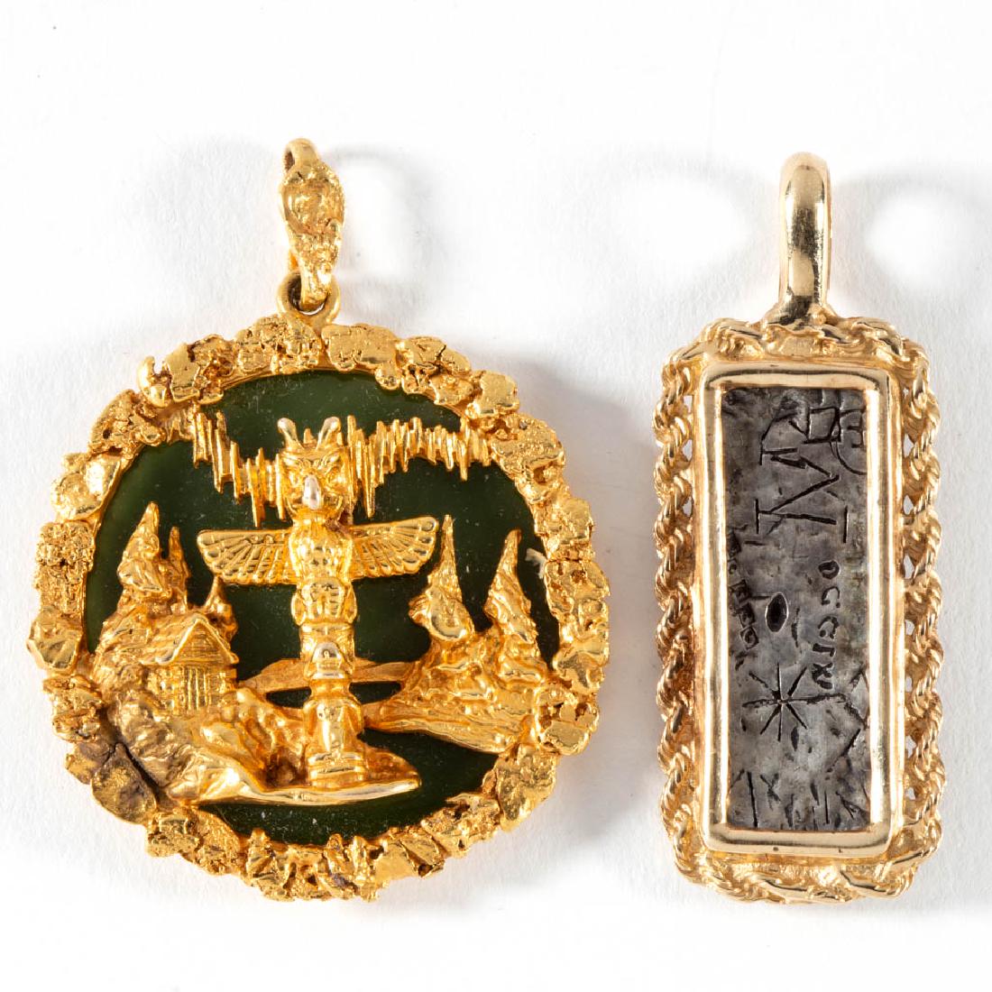 10K AND 14K YELLOW GOLD PENDANTS, LOT OF TWO: 10K AND 14K YELLOW GOLD PENDANTS, LOT OF TWO, comprising a 10K example having totem pole design with nephrite/jade stone backing, and a tested 14K example with rope border holding a sterling silver "A