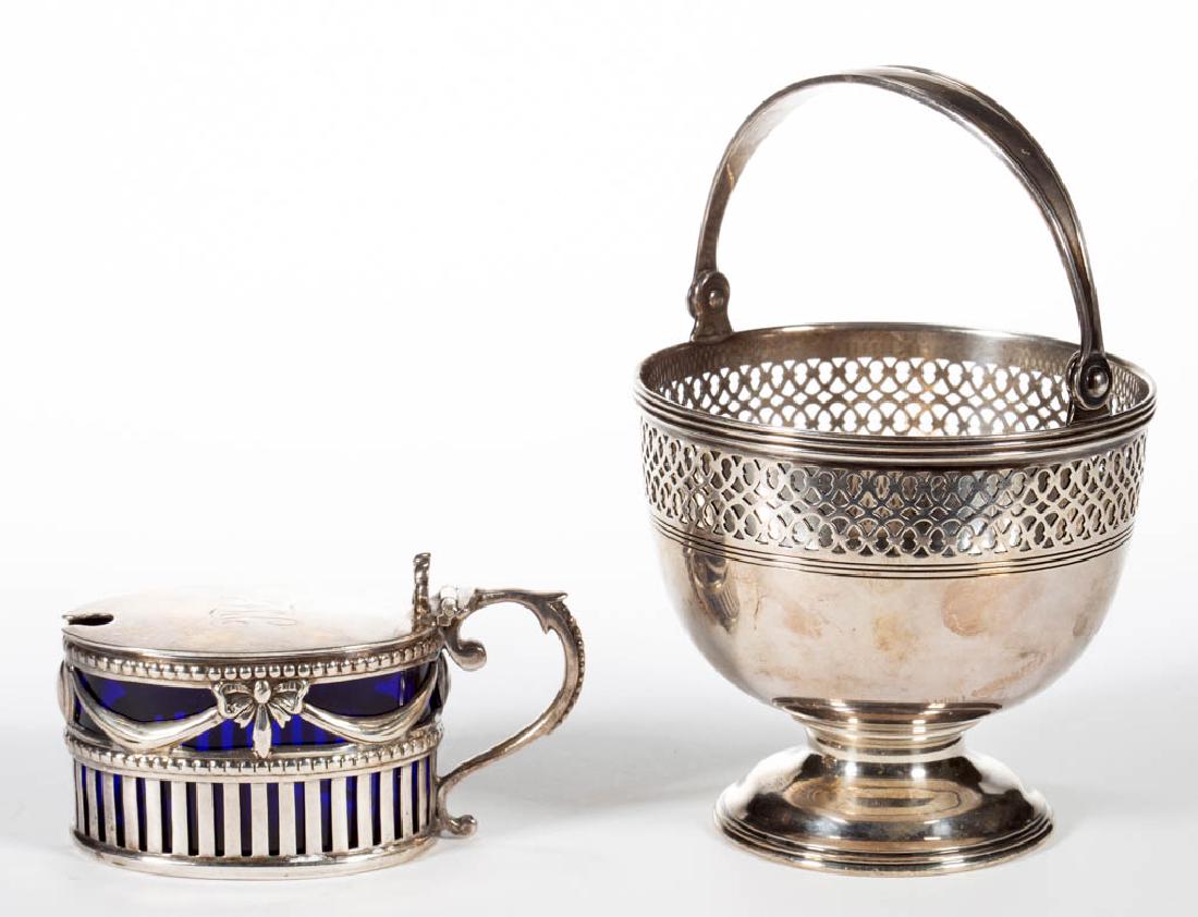TIFFANY & CO. AND WILLIAM HUTTON & SONS STERLING SILVER: TIFFANY & CO. AND WILLIAM HUTTON & SONS STERLING SILVER ARTICLES, LOT OF TWO, comprising a small basket by Tiffany & Co. with reticulated side border, hinged bail handle and open base, and a reticulat