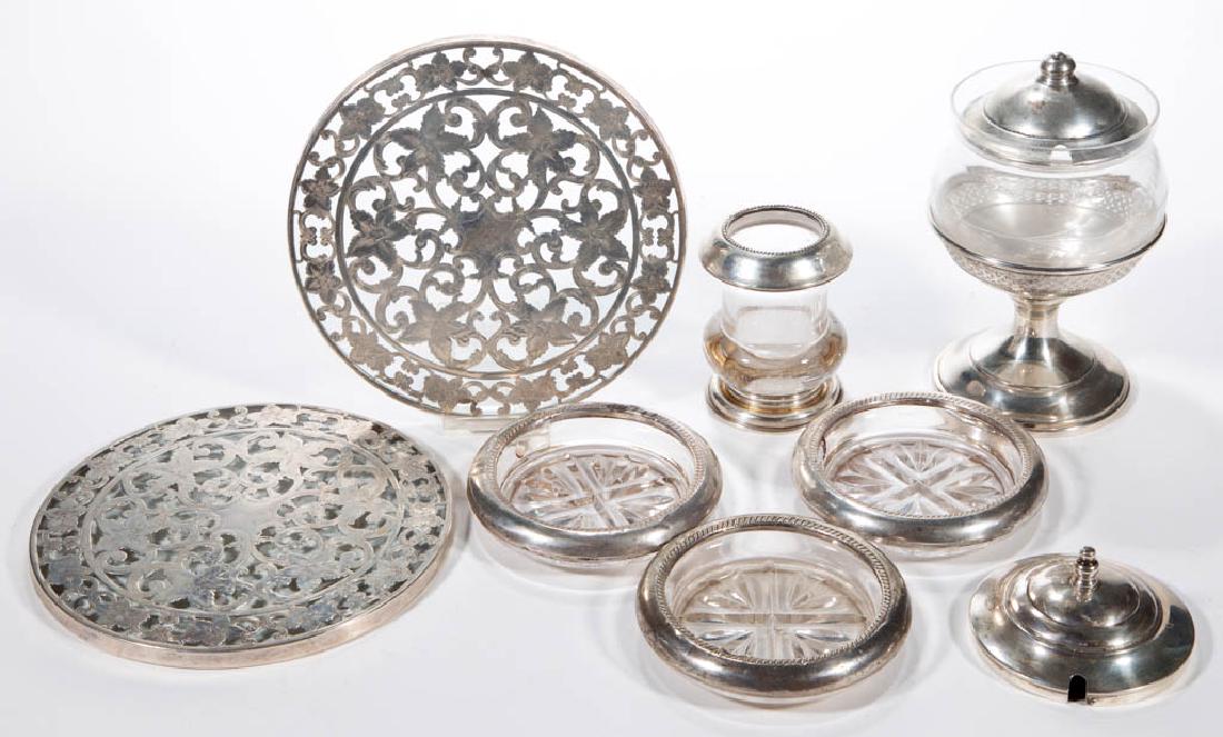 WEBSTER CO. AND OTHER STERLING SILVER AND GLASS: WEBSTER CO. AND OTHER STERLING SILVER AND GLASS ARTICLES, LOT OF SEVEN, comprising a pair of overlay trivets by Webster Co., a jam jar with a stand by Elgin Silversmiths Co., a toothpick holder by Fra