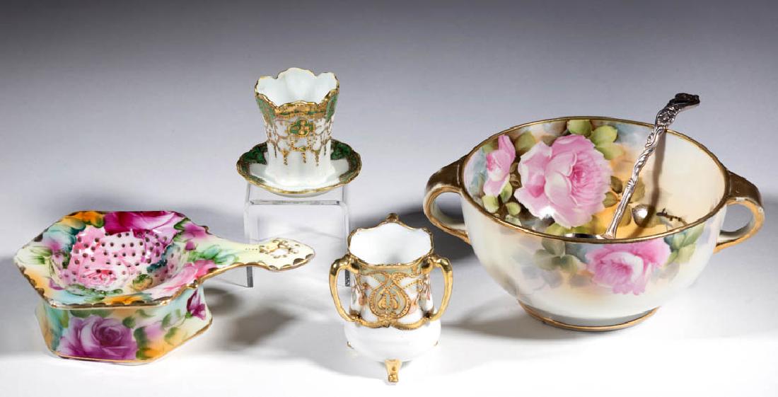 NIPPON PORCELAIN ARTICLES, LOT OF FOUR: NIPPON PORCELAIN ARTICLES, LOT OF FOUR, comprising a tea strainer with base having polychrome hand-painted floral decoration, a 5 1/2" D two-handled bowl having hand-painted rose decoration with "W. R