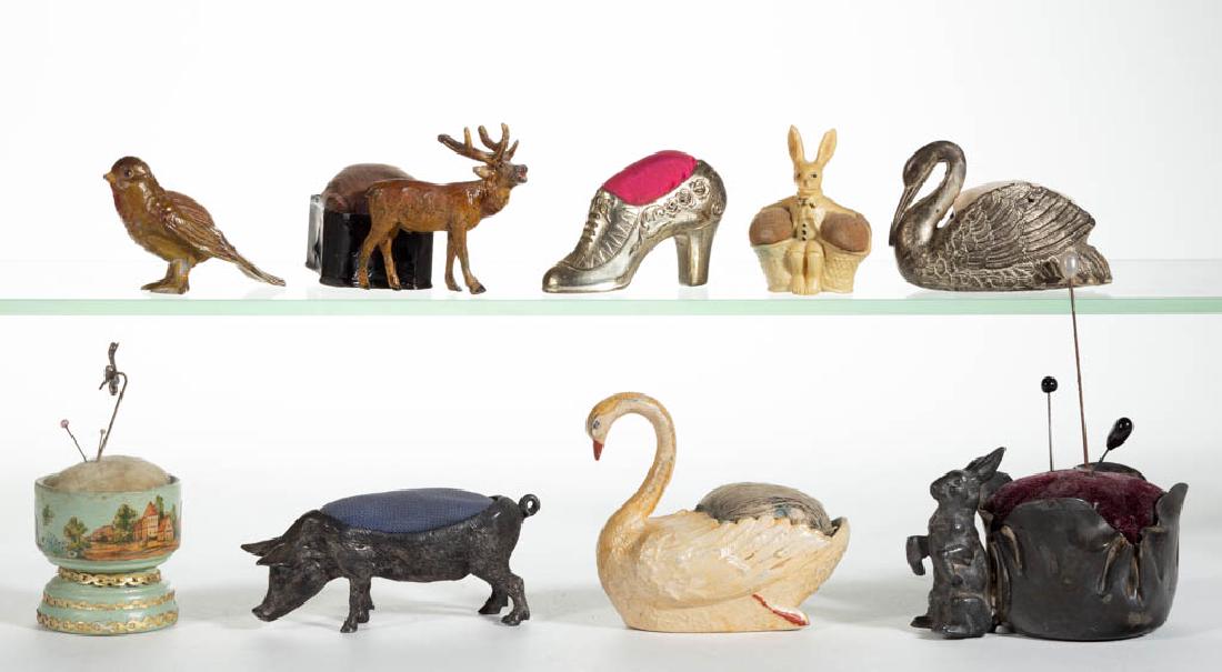 ASSORTED FIGURAL AND OTHER PIN CUSHIONS, LOT OF NINE (1 of 2)