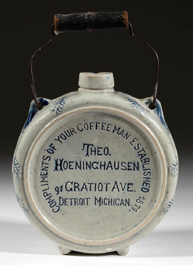 AMERICAN WHITE'S, UTICA, NEW YORK MOLDED STONEWARE: AMERICAN WHITE'S, UTICA, NEW YORK MOLDED STONEWARE ADVERTISING FLASK, salt-glazed, canteen-form with bail handle, having "COMPLIMENTS OF YOUR COFFEE MAN ESTABLISHED 1879 / THEO. HOENINGHAUSEN / 91 GRA