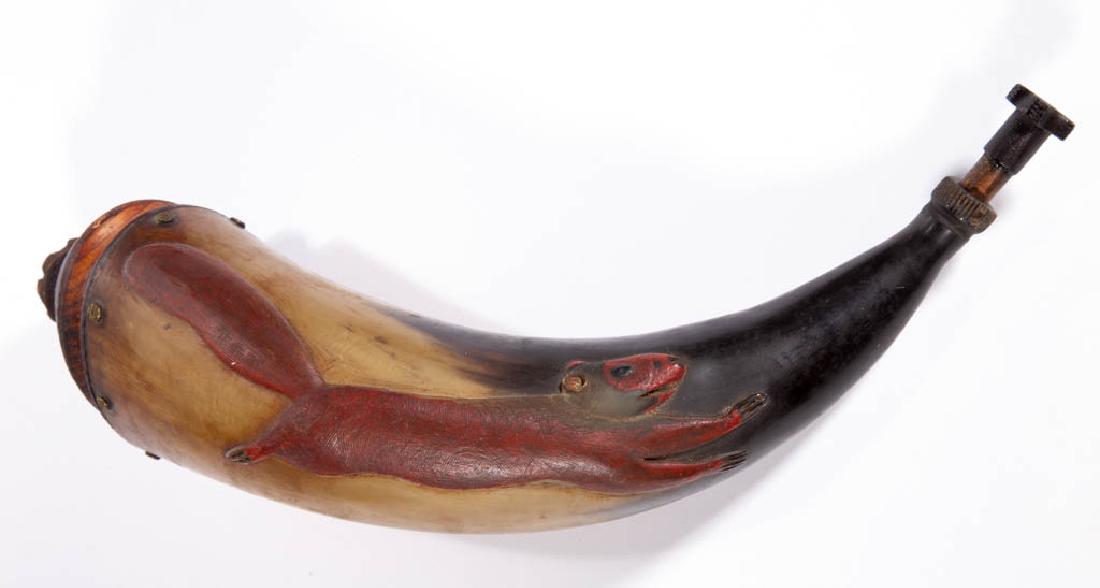 FOLK ART RELIEF CARVED AND PAINTED POWDER HORN: FOLK ART RELIEF CARVED AND PAINTED POWDER HORN, depicting a running squirrel. Squirrel retains an old, probably original, red-painted surface. Plug with applied copper-tube stamped "24". 19th/20th cen