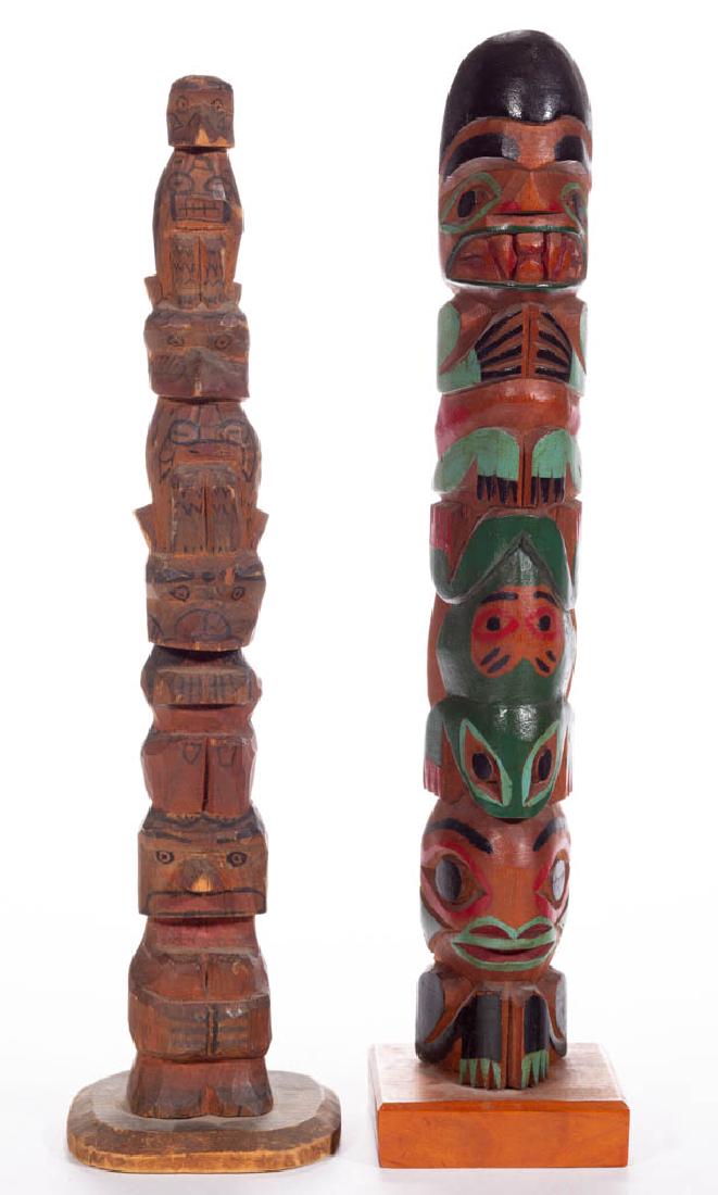 NATIVE AMERICAN CARVED AND PAINTED TOTEM POLES, LOT OF: NATIVE AMERICAN CARVED AND PAINTED TOTEM POLES, LOT OF TWO, each carved from a single-piece of wood and applied to a base, and Northwest Coast-Style. Each retain original painted surface. 20th century