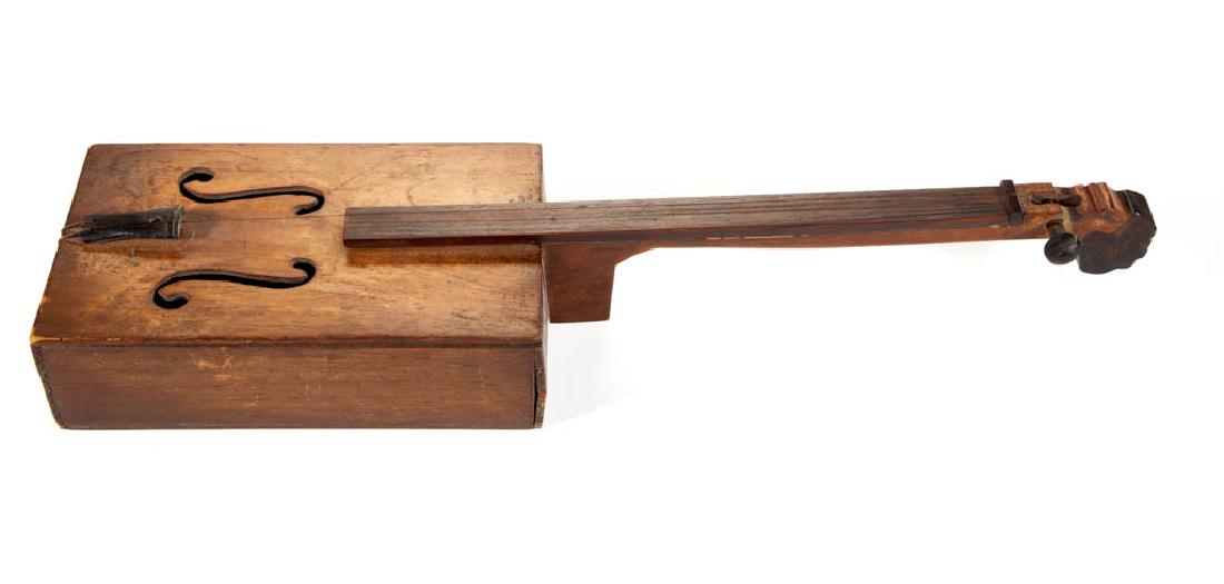 SOUTHWEST VIRGINIA CARVED AND PAINTED WALNUT FOLK: SOUTHWEST VIRGINIA CARVED AND PAINTED WALNUT FOLK FIDDLE, "cigar box" style with polychrome Black Americana figural female bust at neck terminus. Likely original surface with rich color. Circa 1920. 2