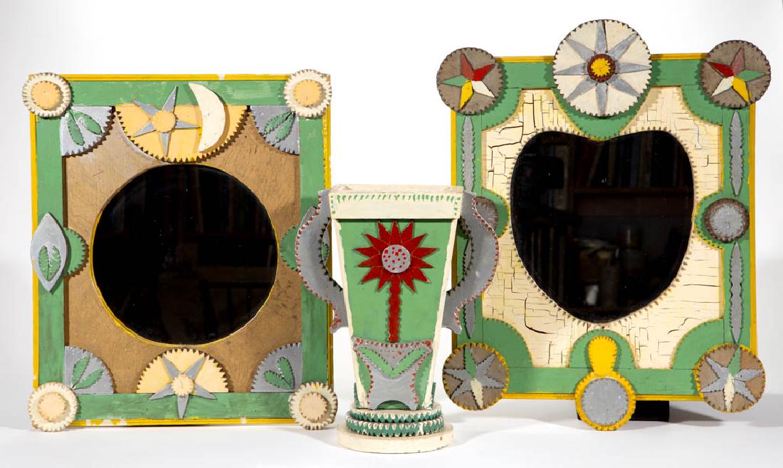 AMERICAN FOLK / TRAMP ART PAINTED PAIR OF FRAMES AND: AMERICAN FOLK / TRAMP ART PAINTED PAIR OF FRAMES AND VASE, frames with heart and circular cut-outs with mirrors, vase with applied flowers in pots on both sides, with applied handles. Original paint-d