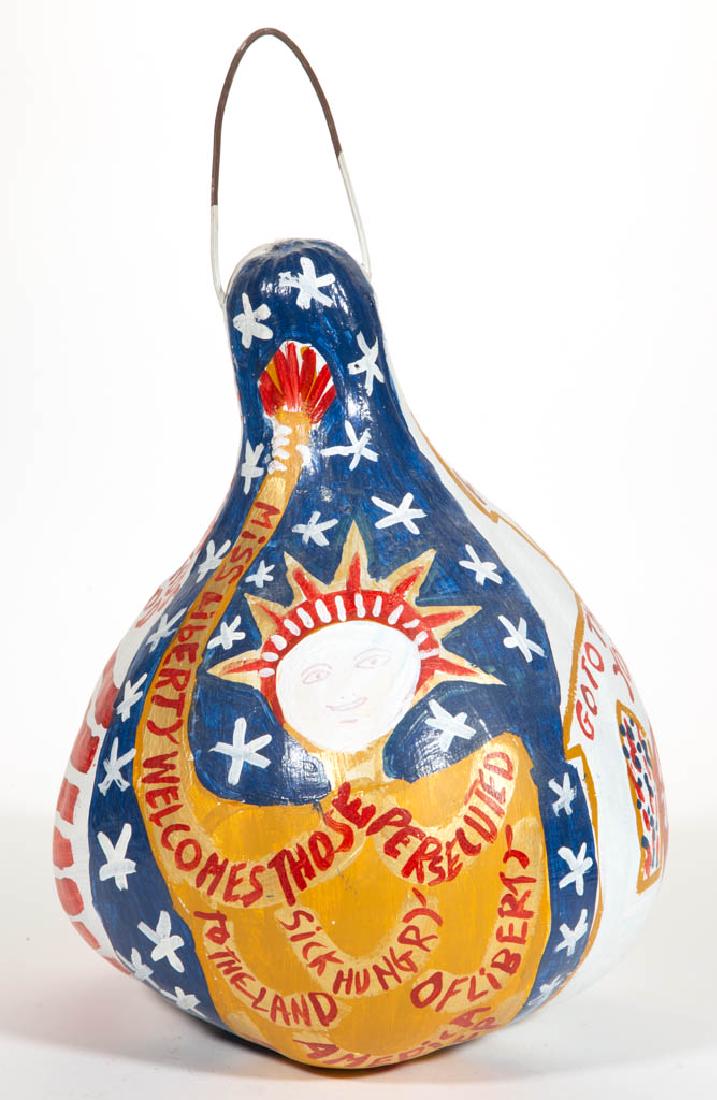 REVEREND BENJAMIN FRANKLIN "B. F." PERKINS (ALABAMA,: REVEREND BENJAMIN FRANKLIN "B. F." PERKINS (ALABAMA, 1904-1993) OUTSIDER ART GOURD PAINTING, typical form with electrical wire for handle, design featuring Miss Liberty, flag, and various inscriptions