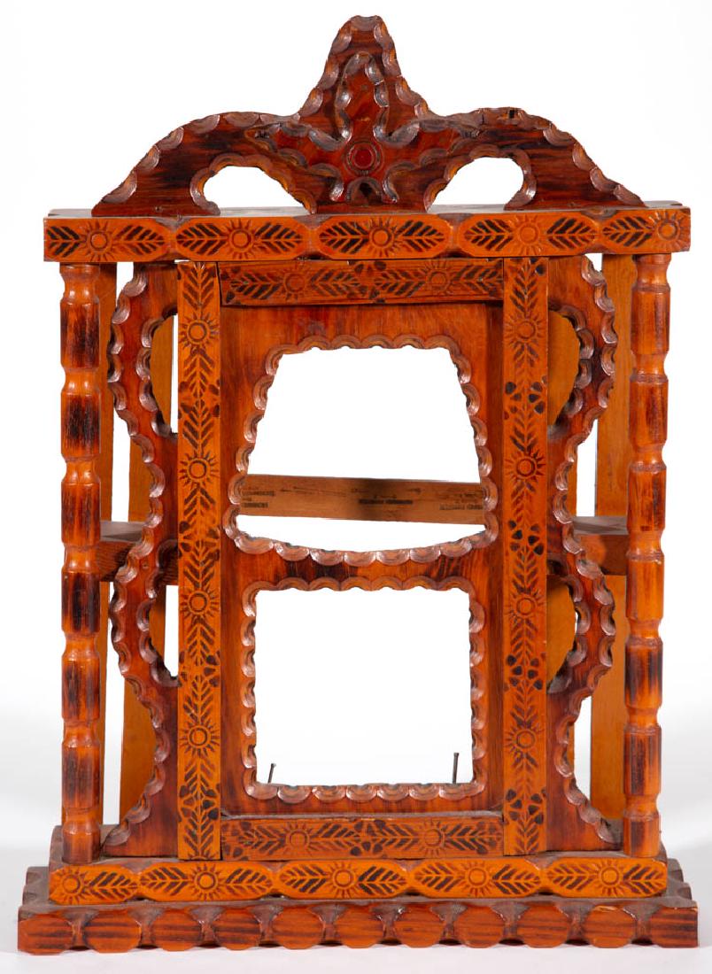 HOWARD FINSTER (GEORGIA, 1916-2001) OUTSIDER ART CARVED: HOWARD FINSTER (GEORGIA, 1916-2001) OUTSIDER ART CARVED CLOCK CASE, signed with Finster ink stamp. Original varnished surface with pyrographic decoration. Circa 1987. 16 3/4" HOA, 12 1/4" WOA. Excelle