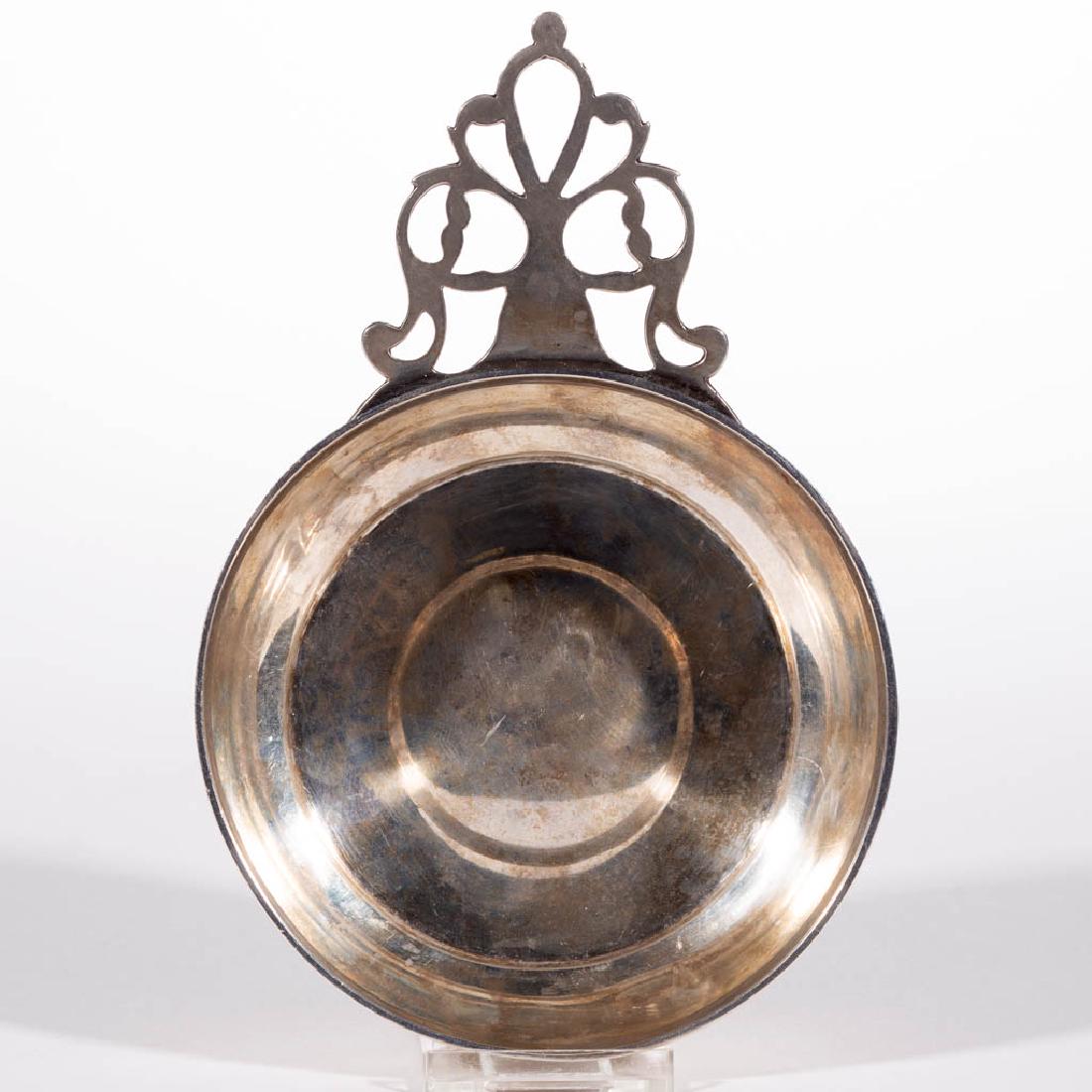 AMERICAN COIN SILVER PORRINGER: AMERICAN COIN SILVER PORRINGER, having an openwork handle, "E. Bradshaw / to / M. A. Harman" and "From E. and A. Harman" engraved to side. Unmarked. Total weight: 3.745 ozt. 18th/19th century. 4 1/4" 
