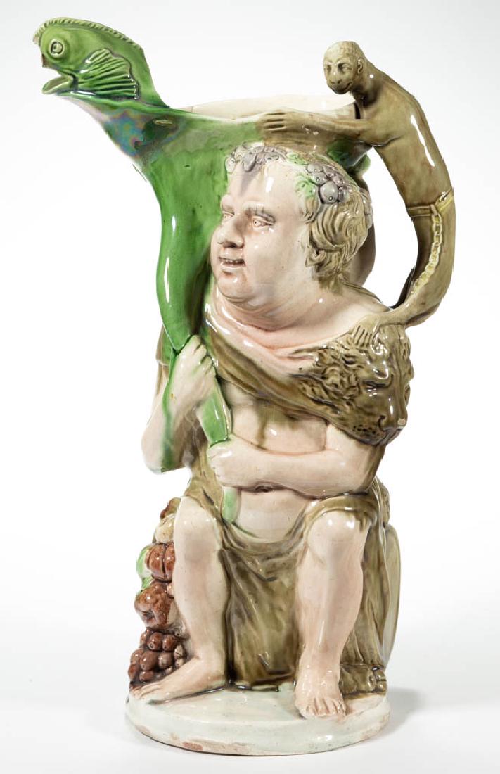 ENGLISH STAFFORDSHIRE PEARLWARE BACCHUS CERAMIC FIGURAL: ENGLISH STAFFORDSHIRE PEARLWARE BACCHUS CERAMIC FIGURAL JUG, featuring a figure wearing a lion's head shawl sitting on a barrel, with figural fish on right shoulder (spout), a monkey standing on his l