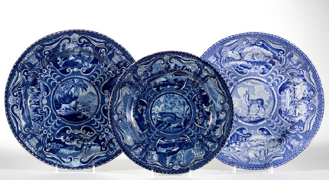 ENGLISH STAFFORDSHIRE PEARLWARE TRANSFER-PRINTED: ENGLISH STAFFORDSHIRE PEARLWARE TRANSFER-PRINTED "QUADRUPEDS" CERAMIC PLATES, LOT OF THREE, comprising one having central transfer image of a otter holding a fish in mouth and one with lion and cattle