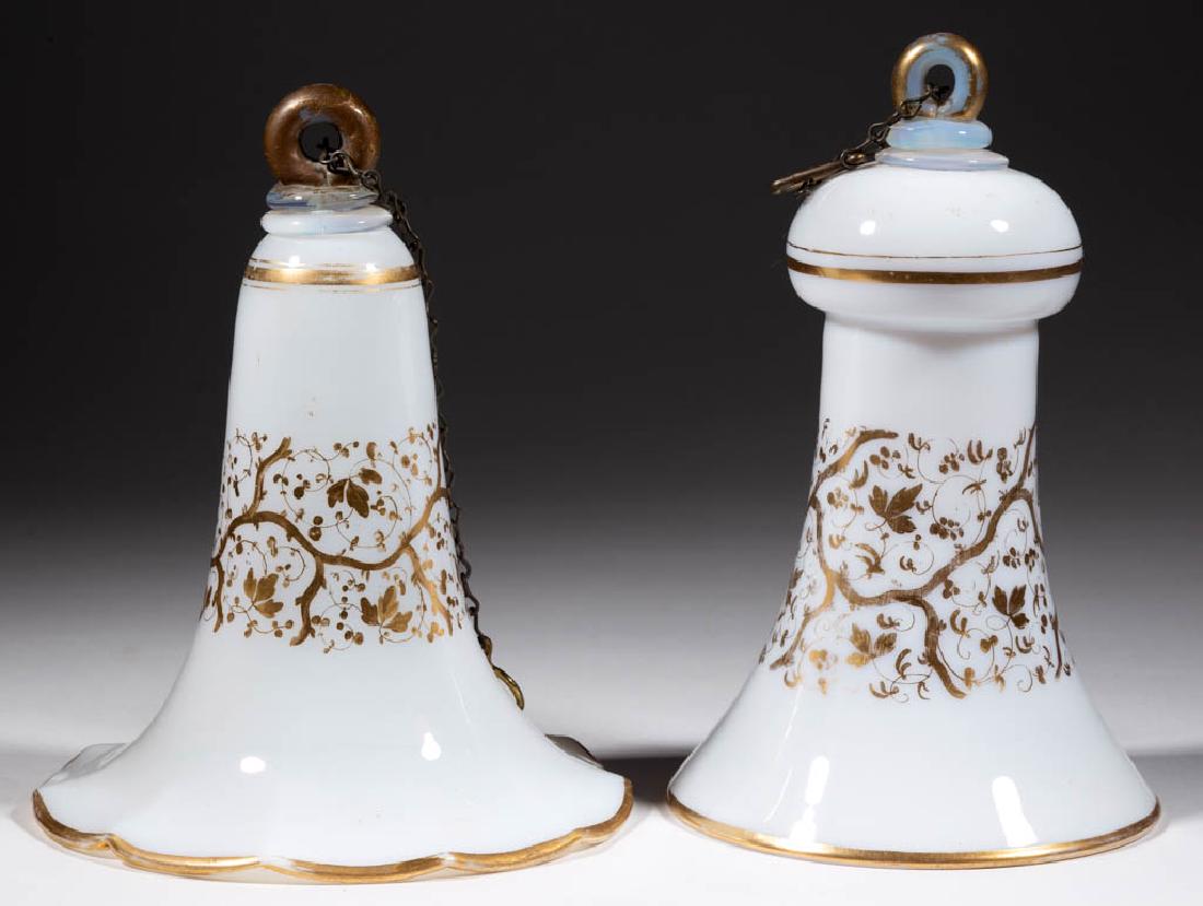 FREE-BLOWN AND GAUFFERED SMOKE BELLS, LOT OF TWO: FREE-BLOWN AND GAUFFERED SMOKE BELLS, LOT OF TWO, deep fiery opal with gilt decoration, comprising one with bulbous top and the other trumpet form, each having an applied glass hanging ring. Later cha