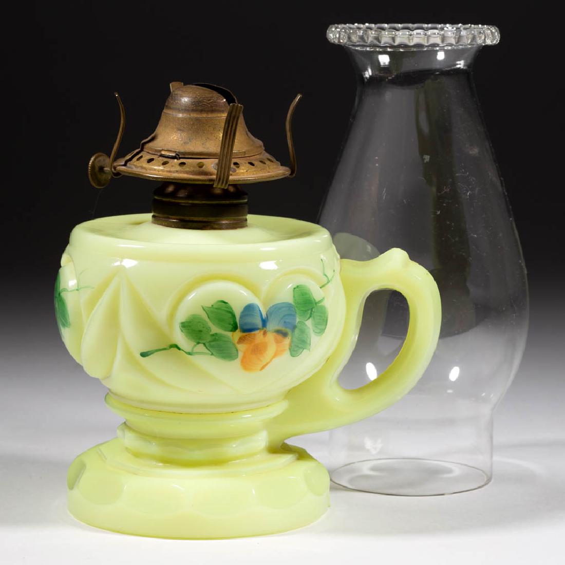 HEART KEROSENE FOOTED FINGER LAMP: HEART KEROSENE FOOTED FINGER LAMP, custard (reacts under black light) with polychrome-enamel decoration, No. 1 Taplin-Brown collar. Fitted with a period No. 1 "VICTOR" slip burner and slip chimney wit