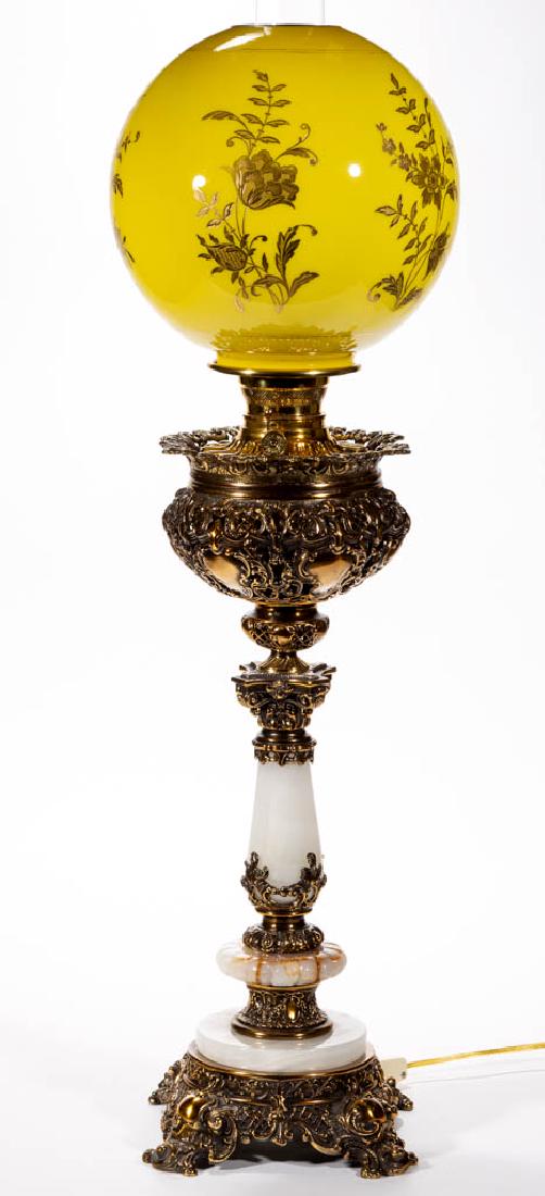 VICTORIAN CAST-METAL AND ALABASTER KEROSENE BANQUET: VICTORIAN CAST-METAL AND ALABASTER KEROSENE BANQUET LAMP, cased yellow ball shade with gilt floral decoration, cast-metal gothic scrolling font vase, brass drop-in font, columnar cast-metal connector,