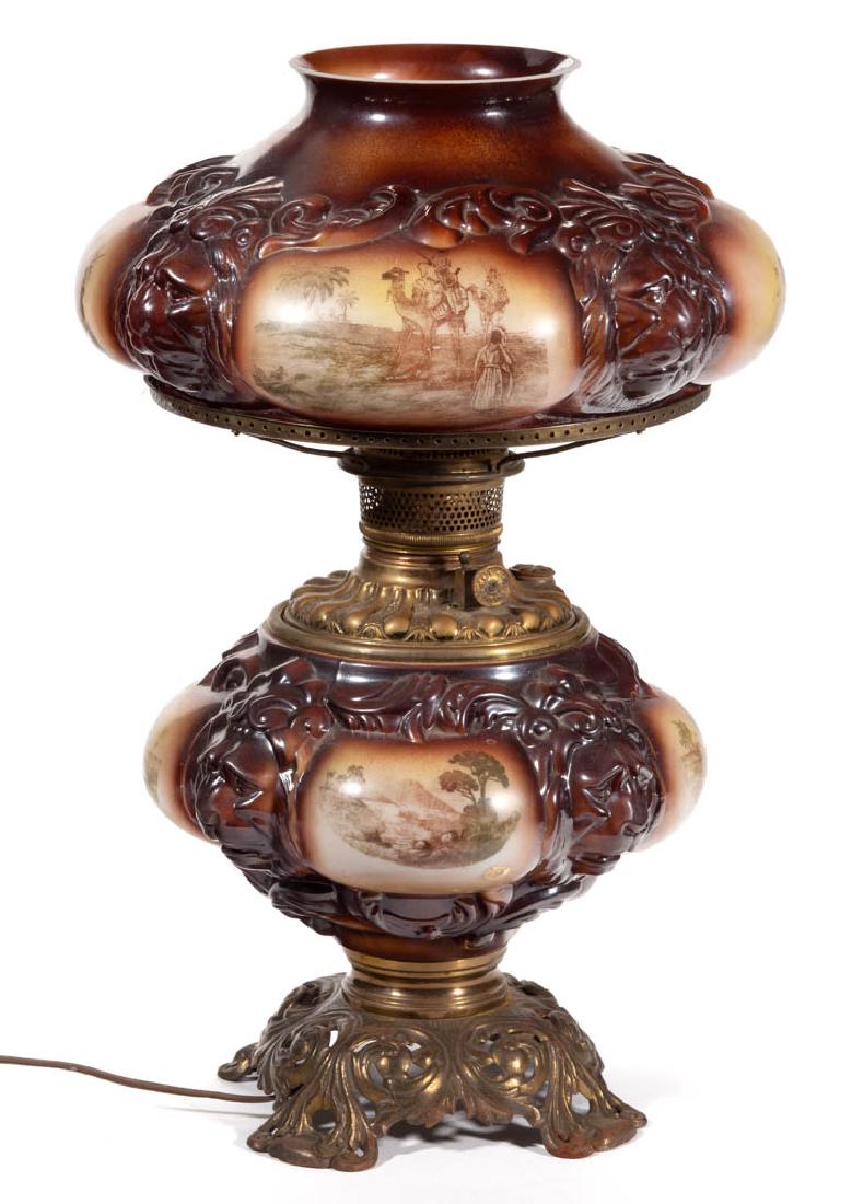 CONSOLIDATED LION KEROSENE GONE WITH THE WIND / PARLOR: CONSOLIDATED LION KEROSENE GONE WITH THE WIND / PARLOR LAMP, opaque white with brown and yellow shading with Middle Eastern/Safari stencil-decoration, matching decorated umbrella-form shade, compresse