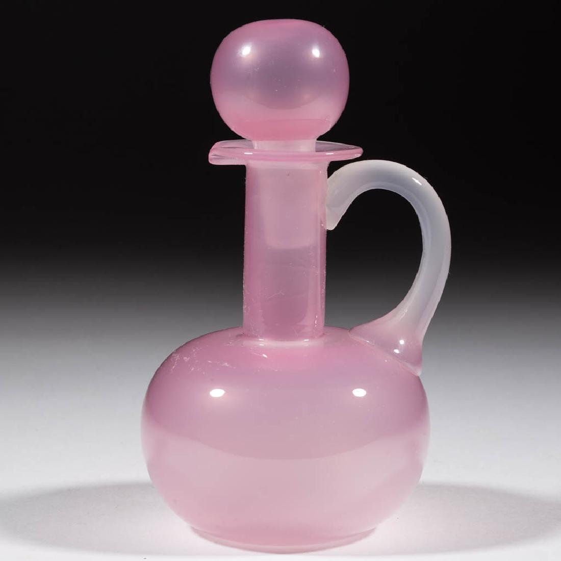 MURANO ROSALINE GLASS CRUET: MURANO ROSALINE GLASS CRUET, Pink Rosaline and Alabaster, (UPDATED 7/16/19) bulbous form with applied handle, polished pontil mark, faux acid-stamped signature. Italy. 20th century. 6 1/8" HOA, 4 3/4"